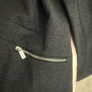 Calvin Klein Charcoal Blazer with Zipper closure and pockets.